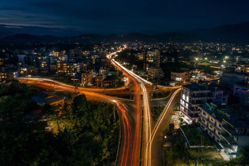 Night aerial view of a Bardibas highway junction with traffic light trails